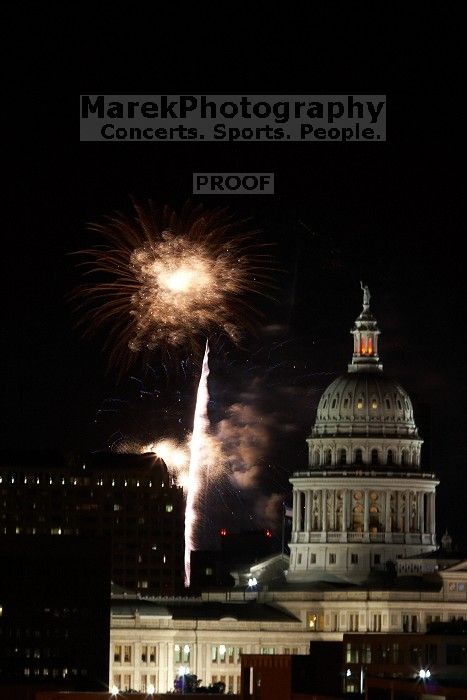 Austin Independence Day fireworks with the Capitol building, as viewed from atop the Manor Garage at The University of Texas at Austin.  The fireworks were launched from Auditorium Shores, downtown Austin, Friday, July 4, 2008.

Filename: SRM_20080704_2154144.jpg
Aperture: f/11.0
Shutter Speed: 2/1
Body: Canon EOS 20D
Lens: Canon EF 80-200mm f/2.8 L