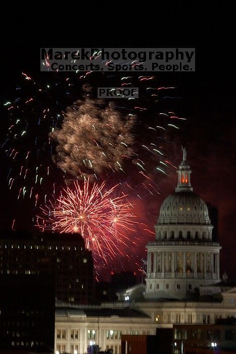 Austin Independence Day fireworks with the Capitol building, as viewed from atop the Manor Garage at The University of Texas at Austin.  The fireworks were launched from Auditorium Shores, downtown Austin, Friday, July 4, 2008.

Filename: SRM_20080704_2154522.jpg
Aperture: f/11.0
Shutter Speed: 1/1
Body: Canon EOS 20D
Lens: Canon EF 80-200mm f/2.8 L