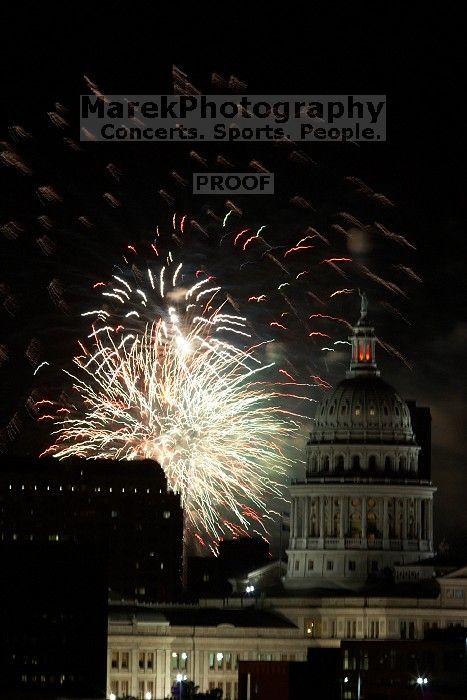 Austin Independence Day fireworks with the Capitol building, as viewed from atop the Manor Garage at The University of Texas at Austin.  The fireworks were launched from Auditorium Shores, downtown Austin, Friday, July 4, 2008.

Filename: SRM_20080704_2155046.jpg
Aperture: f/11.0
Shutter Speed: 1/1
Body: Canon EOS 20D
Lens: Canon EF 80-200mm f/2.8 L