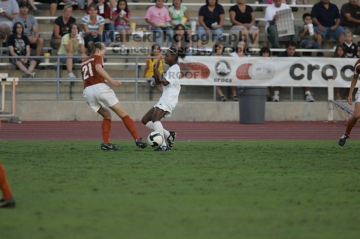 UT junior Emily Anderson (#21, Forward)The University of Texas women's soccer team tied 0-0 against the Texas A&M Aggies Friday night, September 27, 2008.

Filename: SRM_20080926_1909041.jpg
Aperture: f/4.0
Shutter Speed: 1/800
Body: Canon EOS-1D Mark II
Lens: Canon EF 300mm f/2.8 L IS