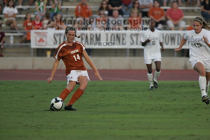 UT senior Kasey Moore (#14, Defender) clears the ball.  The University of Texas women's soccer team tied 0-0 against the Texas A&M Aggies Friday night, September 27, 2008.

Filename: SRM_20080926_1909088.jpg
Aperture: f/4.0
Shutter Speed: 1/800
Body: Canon EOS-1D Mark II
Lens: Canon EF 300mm f/2.8 L IS