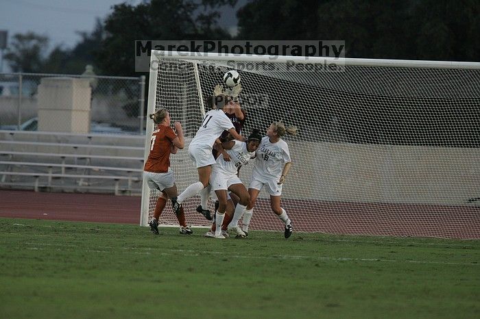 UT freshman Courtney Goodson (#7, Forward and Midfielder) loses the ball to the A&M goalkeeper.  The University of Texas women's soccer team tied 0-0 against the Texas A&M Aggies Friday night, September 27, 2008.

Filename: SRM_20080926_1909584.jpg
Aperture: f/4.0
Shutter Speed: 1/1000
Body: Canon EOS-1D Mark II
Lens: Canon EF 300mm f/2.8 L IS