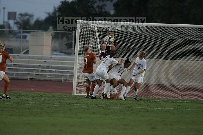 UT freshman Courtney Goodson (#7, Forward and Midfielder) loses the ball to the A&M goalkeeper.  The University of Texas women's soccer team tied 0-0 against the Texas A&M Aggies Friday night, September 27, 2008.

Filename: SRM_20080926_1909586.jpg
Aperture: f/4.0
Shutter Speed: 1/1000
Body: Canon EOS-1D Mark II
Lens: Canon EF 300mm f/2.8 L IS