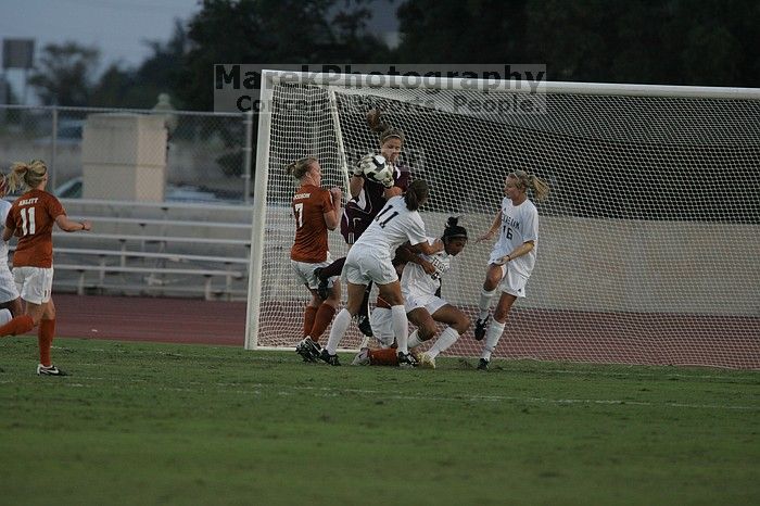 UT freshman Courtney Goodson (#7, Forward and Midfielder) loses the ball to the A&M goalkeeper.  The University of Texas women's soccer team tied 0-0 against the Texas A&M Aggies Friday night, September 27, 2008.

Filename: SRM_20080926_1910007.jpg
Aperture: f/4.0
Shutter Speed: 1/1000
Body: Canon EOS-1D Mark II
Lens: Canon EF 300mm f/2.8 L IS