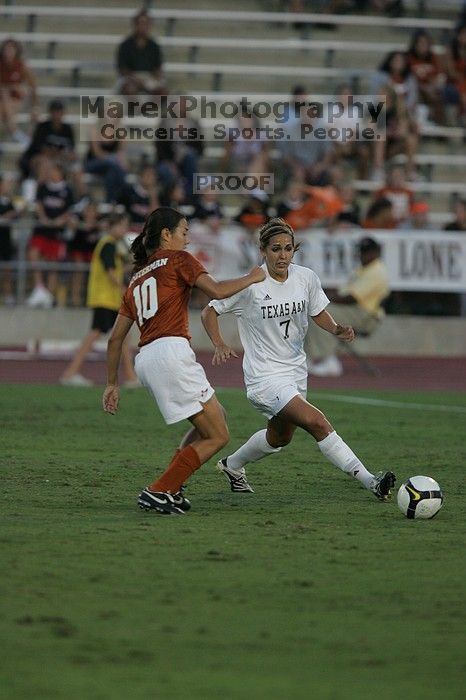 UT senior Stephanie Logterman (#10, Defender).  The University of Texas women's soccer team tied 0-0 against the Texas A&M Aggies Friday night, September 27, 2008.

Filename: SRM_20080926_1914480.jpg
Aperture: f/4.0
Shutter Speed: 1/800
Body: Canon EOS-1D Mark II
Lens: Canon EF 300mm f/2.8 L IS