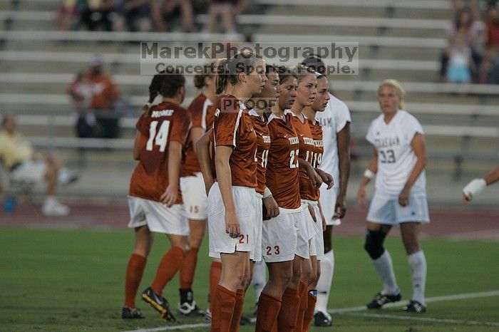 UT senior Kasey Moore (#14, Defender), UT junior Emily Anderson (#21, Forward), UT senior Stephanie Logterman (#10, Defender), UT senior Courtney Gaines (#23, Midfielder), UT sophomore Erica Campanelli (#19, Defender) form a wall in front of a free kick.  The University of Texas women's soccer team tied 0-0 against the Texas A&M Aggies Friday night, September 27, 2008.

Filename: SRM_20080926_1918065.jpg
Aperture: f/4.0
Shutter Speed: 1/640
Body: Canon EOS-1D Mark II
Lens: Canon EF 300mm f/2.8 L IS