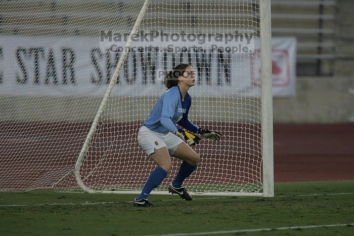 UT senior Dianna Pfenninger (#8, Goalkeeper) waits for a shot.  The University of Texas women's soccer team tied 0-0 against the Texas A&M Aggies Friday night, September 27, 2008.

Filename: SRM_20080926_1918080.jpg
Aperture: f/4.0
Shutter Speed: 1/800
Body: Canon EOS-1D Mark II
Lens: Canon EF 300mm f/2.8 L IS