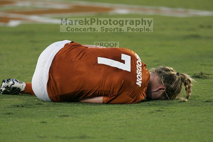 UT freshman Courtney Goodson (#7, Forward and Midfielder) lies on the field injured.  The University of Texas women's soccer team tied 0-0 against the Texas A&M Aggies Friday night, September 27, 2008.

Filename: SRM_20080926_1924364.jpg
Aperture: f/4.0
Shutter Speed: 1/320
Body: Canon EOS-1D Mark II
Lens: Canon EF 300mm f/2.8 L IS