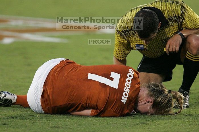 UT freshman Courtney Goodson (#7, Forward and Midfielder) lies on the field injured.  The University of Texas women's soccer team tied 0-0 against the Texas A&M Aggies Friday night, September 27, 2008.

Filename: SRM_20080926_1924447.jpg
Aperture: f/4.0
Shutter Speed: 1/250
Body: Canon EOS-1D Mark II
Lens: Canon EF 300mm f/2.8 L IS