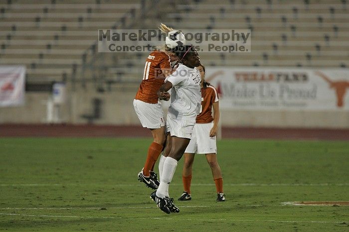 UT sophomore Niki Arlitt (#11, Forward) battles for a header in the air.  The University of Texas women's soccer team tied 0-0 against the Texas A&M Aggies Friday night, September 27, 2008.

Filename: SRM_20080926_1931241.jpg
Aperture: f/4.0
Shutter Speed: 1/500
Body: Canon EOS-1D Mark II
Lens: Canon EF 300mm f/2.8 L IS