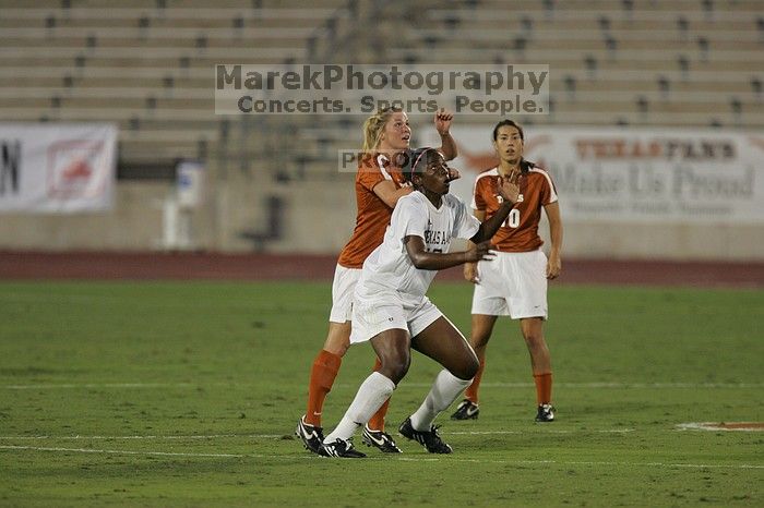 UT sophomore Niki Arlitt (#11, Forward) battles for a header in the air.  The University of Texas women's soccer team tied 0-0 against the Texas A&M Aggies Friday night, September 27, 2008.

Filename: SRM_20080926_1931249.jpg
Aperture: f/4.0
Shutter Speed: 1/400
Body: Canon EOS-1D Mark II
Lens: Canon EF 300mm f/2.8 L IS