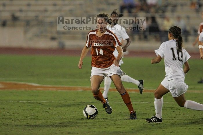 UT senior Kasey Moore (#14, Defender) brings the ball downfield.  The University of Texas women's soccer team tied 0-0 against the Texas A&M Aggies Friday night, September 27, 2008.

Filename: SRM_20080926_1935400.jpg
Aperture: f/4.0
Shutter Speed: 1/500
Body: Canon EOS-1D Mark II
Lens: Canon EF 300mm f/2.8 L IS