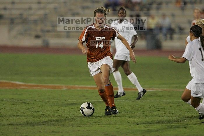 UT senior Kasey Moore (#14, Defender) brings the ball downfield.  The University of Texas women's soccer team tied 0-0 against the Texas A&M Aggies Friday night, September 27, 2008.

Filename: SRM_20080926_1935409.jpg
Aperture: f/4.0
Shutter Speed: 1/500
Body: Canon EOS-1D Mark II
Lens: Canon EF 300mm f/2.8 L IS