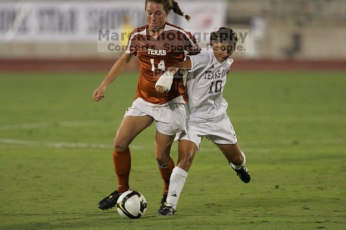 UT senior Kasey Moore (#14, Defender) brings the ball downfield.  The University of Texas women's soccer team tied 0-0 against the Texas A&M Aggies Friday night, September 27, 2008.

Filename: SRM_20080926_1935441.jpg
Aperture: f/4.0
Shutter Speed: 1/400
Body: Canon EOS-1D Mark II
Lens: Canon EF 300mm f/2.8 L IS