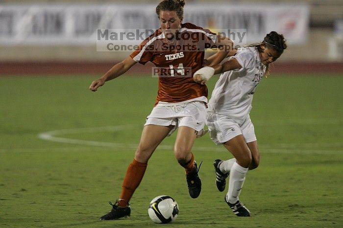 UT senior Kasey Moore (#14, Defender) brings the ball downfield.  The University of Texas women's soccer team tied 0-0 against the Texas A&M Aggies Friday night, September 27, 2008.

Filename: SRM_20080926_1935442.jpg
Aperture: f/4.0
Shutter Speed: 1/500
Body: Canon EOS-1D Mark II
Lens: Canon EF 300mm f/2.8 L IS