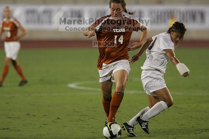 UT senior Kasey Moore (#14, Defender) brings the ball downfield.  The University of Texas women's soccer team tied 0-0 against the Texas A&M Aggies Friday night, September 27, 2008.

Filename: SRM_20080926_1935443.jpg
Aperture: f/4.0
Shutter Speed: 1/500
Body: Canon EOS-1D Mark II
Lens: Canon EF 300mm f/2.8 L IS