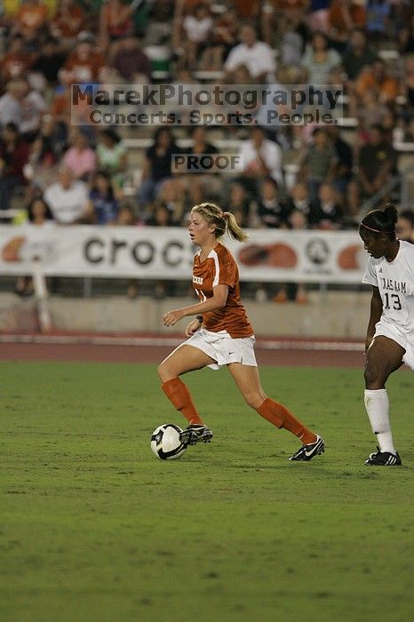 UT sophomore Niki Arlitt (#11, Forward).  The University of Texas women's soccer team tied 0-0 against the Texas A&M Aggies Friday night, September 27, 2008.

Filename: SRM_20080926_1936080.jpg
Aperture: f/4.0
Shutter Speed: 1/400
Body: Canon EOS-1D Mark II
Lens: Canon EF 300mm f/2.8 L IS