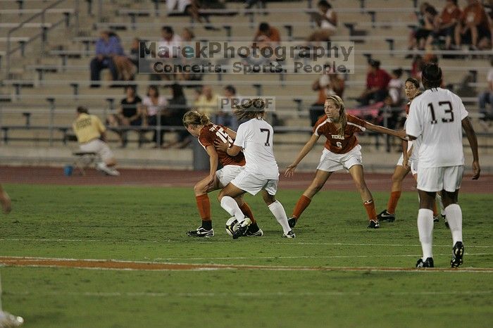 UT freshman Kylie Doniak (#15, Midfielder) tries to turn the ball as UT freshman Lucy Keith (#6, Midfielder) gives her support.  The University of Texas women's soccer team tied 0-0 against the Texas A&M Aggies Friday night, September 27, 2008.

Filename: SRM_20080926_1936589.jpg
Aperture: f/4.0
Shutter Speed: 1/500
Body: Canon EOS-1D Mark II
Lens: Canon EF 300mm f/2.8 L IS