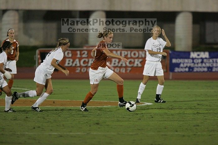 UT freshman Kylie Doniak (#15, Midfielder) tackles the ball as UT sophomore Erica Campanelli (#19, Defender) watches.  The University of Texas women's soccer team tied 0-0 against the Texas A&M Aggies Friday night, September 27, 2008.

Filename: SRM_20080926_1942081.jpg
Aperture: f/4.0
Shutter Speed: 1/500
Body: Canon EOS-1D Mark II
Lens: Canon EF 300mm f/2.8 L IS