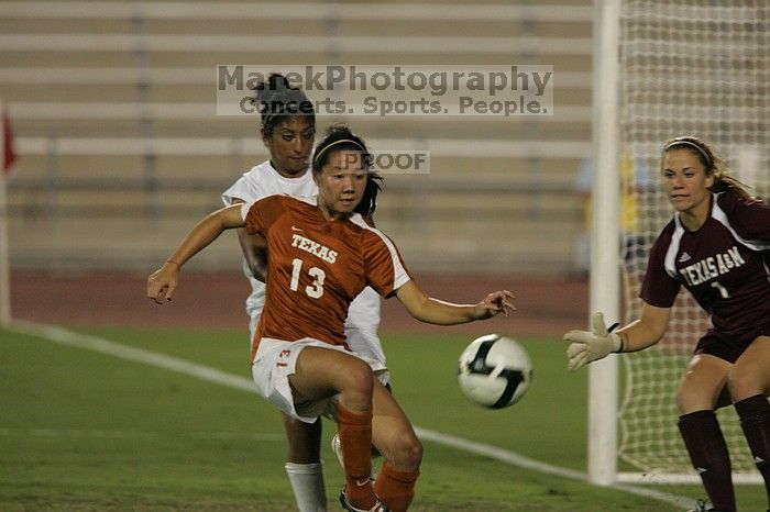 UT freshman Amanda Lisberger (#13, Midfielder) takes a shot on goal.  The University of Texas women's soccer team tied 0-0 against the Texas A&M Aggies Friday night, September 27, 2008.

Filename: SRM_20080926_1945181.jpg
Aperture: f/4.0
Shutter Speed: 1/500
Body: Canon EOS-1D Mark II
Lens: Canon EF 300mm f/2.8 L IS