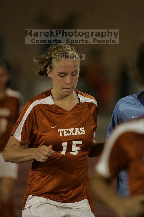 UT freshman Kylie Doniak (#15, Midfielder) running back to the team benches before the second half.  The University of Texas women's soccer team tied 0-0 against the Texas A&M Aggies Friday night, September 27, 2008.

Filename: SRM_20080926_2000465.jpg
Aperture: f/2.8
Shutter Speed: 1/500
Body: Canon EOS-1D Mark II
Lens: Canon EF 300mm f/2.8 L IS