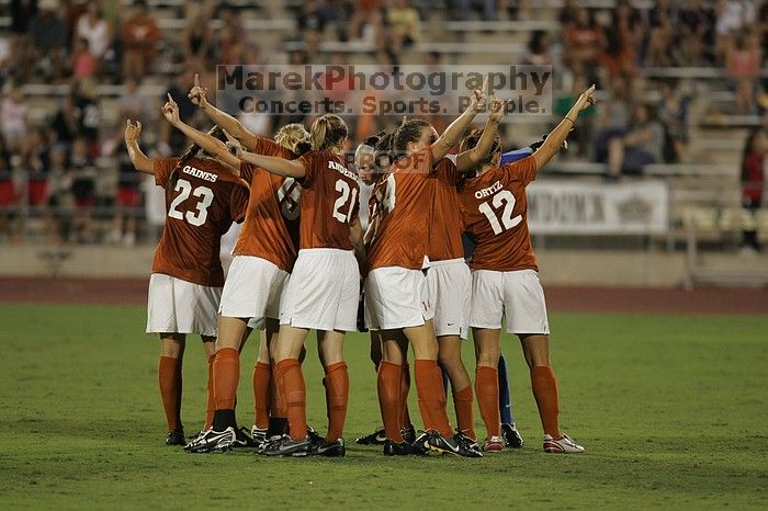 UT senior Courtney Gaines (#23, Midfielder), UT freshman Kylie Doniak (#15, Midfielder), UT junior Emily Anderson (#21, Forward), UT senior Kasey Moore (#14, Defender), UT sophomore Alisha Ortiz (#12, Forward), UT senior Dianna Pfenninger (#8, Goalkeeper) get ready for the start of the second half.  The University of Texas women's soccer team tied 0-0 against the Texas A&M Aggies Friday night, September 27, 2008.

Filename: SRM_20080926_2003102.jpg
Aperture: f/2.8
Shutter Speed: 1/500
Body: Canon EOS-1D Mark II
Lens: Canon EF 300mm f/2.8 L IS