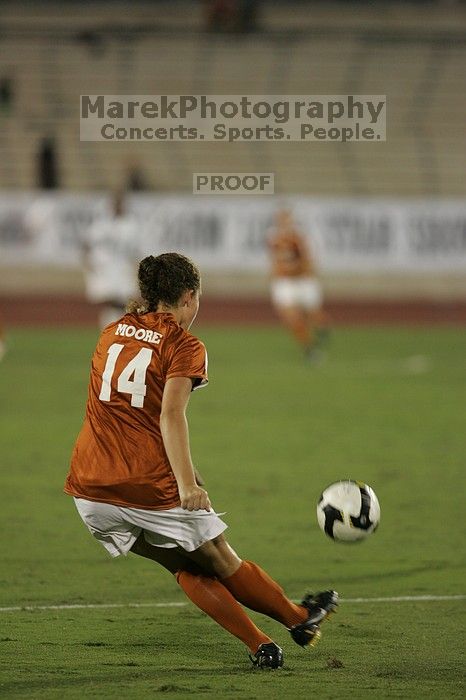 UT senior Kasey Moore (#14, Defender) sends the ball downfield.  The University of Texas women's soccer team tied 0-0 against the Texas A&M Aggies Friday night, September 27, 2008.

Filename: SRM_20080926_2005447.jpg
Aperture: f/2.8
Shutter Speed: 1/500
Body: Canon EOS-1D Mark II
Lens: Canon EF 300mm f/2.8 L IS