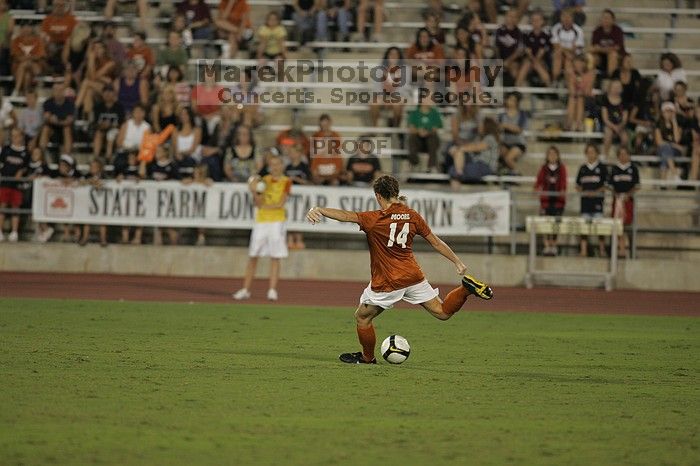 UT senior Kasey Moore (#14, Defender) kicks the ball.  The University of Texas women's soccer team tied 0-0 against the Texas A&M Aggies Friday night, September 27, 2008.

Filename: SRM_20080926_2007222.jpg
Aperture: f/2.8
Shutter Speed: 1/500
Body: Canon EOS-1D Mark II
Lens: Canon EF 300mm f/2.8 L IS