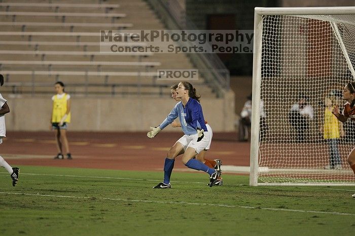 UT senior Dianna Pfenninger (#8, Goalkeeper) tells the defense to push forward.  The University of Texas women's soccer team tied 0-0 against the Texas A&M Aggies Friday night, September 27, 2008.

Filename: SRM_20080926_2011503.jpg
Aperture: f/2.8
Shutter Speed: 1/500
Body: Canon EOS-1D Mark II
Lens: Canon EF 300mm f/2.8 L IS