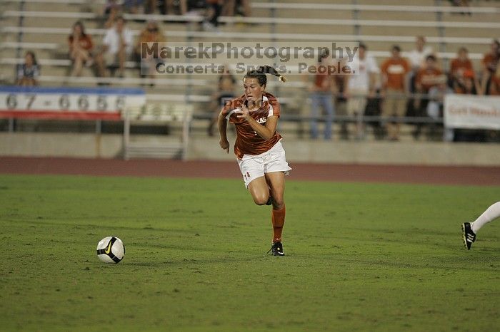 UT senior Kasey Moore (#14, Defender).  The University of Texas women's soccer team tied 0-0 against the Texas A&M Aggies Friday night, September 27, 2008.

Filename: SRM_20080926_2012066.jpg
Aperture: f/2.8
Shutter Speed: 1/500
Body: Canon EOS-1D Mark II
Lens: Canon EF 300mm f/2.8 L IS