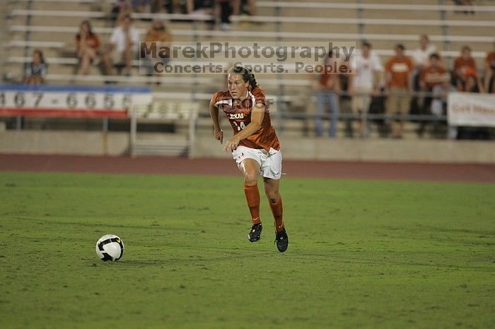 UT senior Kasey Moore (#14, Defender).  The University of Texas women's soccer team tied 0-0 against the Texas A&M Aggies Friday night, September 27, 2008.

Filename: SRM_20080926_2012087.jpg
Aperture: f/2.8
Shutter Speed: 1/500
Body: Canon EOS-1D Mark II
Lens: Canon EF 300mm f/2.8 L IS