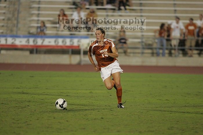 UT senior Kasey Moore (#14, Defender).  The University of Texas women's soccer team tied 0-0 against the Texas A&M Aggies Friday night, September 27, 2008.

Filename: SRM_20080926_2012088.jpg
Aperture: f/2.8
Shutter Speed: 1/500
Body: Canon EOS-1D Mark II
Lens: Canon EF 300mm f/2.8 L IS