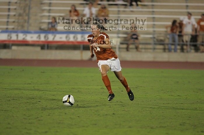 UT senior Kasey Moore (#14, Defender).  The University of Texas women's soccer team tied 0-0 against the Texas A&M Aggies Friday night, September 27, 2008.

Filename: SRM_20080926_2012089.jpg
Aperture: f/2.8
Shutter Speed: 1/500
Body: Canon EOS-1D Mark II
Lens: Canon EF 300mm f/2.8 L IS