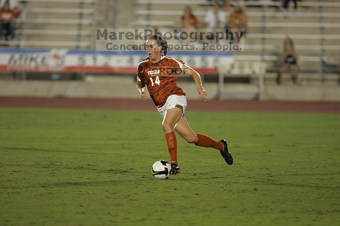 UT senior Kasey Moore (#14, Defender).  The University of Texas women's soccer team tied 0-0 against the Texas A&M Aggies Friday night, September 27, 2008.

Filename: SRM_20080926_2012101.jpg
Aperture: f/2.8
Shutter Speed: 1/500
Body: Canon EOS-1D Mark II
Lens: Canon EF 300mm f/2.8 L IS