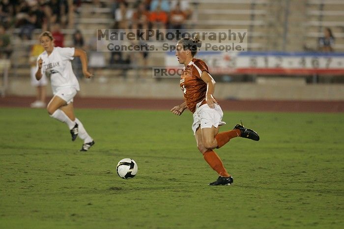 UT senior Kasey Moore (#14, Defender).  The University of Texas women's soccer team tied 0-0 against the Texas A&M Aggies Friday night, September 27, 2008.

Filename: SRM_20080926_2012104.jpg
Aperture: f/2.8
Shutter Speed: 1/500
Body: Canon EOS-1D Mark II
Lens: Canon EF 300mm f/2.8 L IS