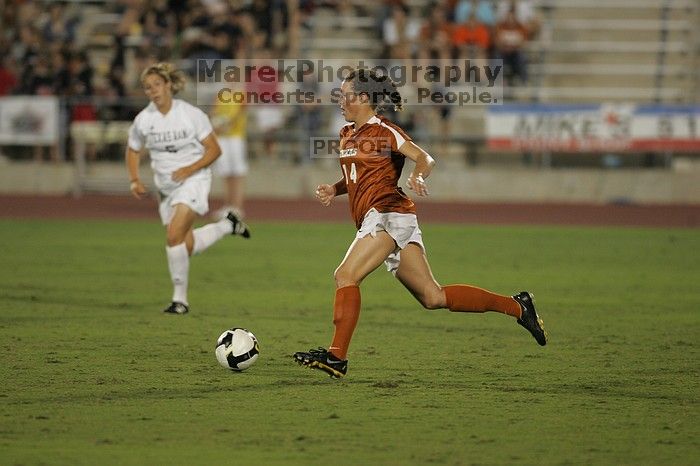 UT senior Kasey Moore (#14, Defender).  The University of Texas women's soccer team tied 0-0 against the Texas A&M Aggies Friday night, September 27, 2008.

Filename: SRM_20080926_2012105.jpg
Aperture: f/2.8
Shutter Speed: 1/500
Body: Canon EOS-1D Mark II
Lens: Canon EF 300mm f/2.8 L IS