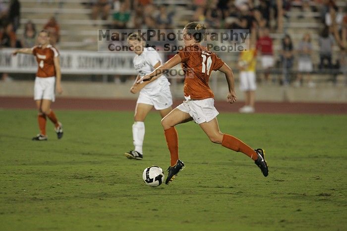 UT senior Kasey Moore (#14, Defender).  The University of Texas women's soccer team tied 0-0 against the Texas A&M Aggies Friday night, September 27, 2008.

Filename: SRM_20080926_2012126.jpg
Aperture: f/2.8
Shutter Speed: 1/500
Body: Canon EOS-1D Mark II
Lens: Canon EF 300mm f/2.8 L IS