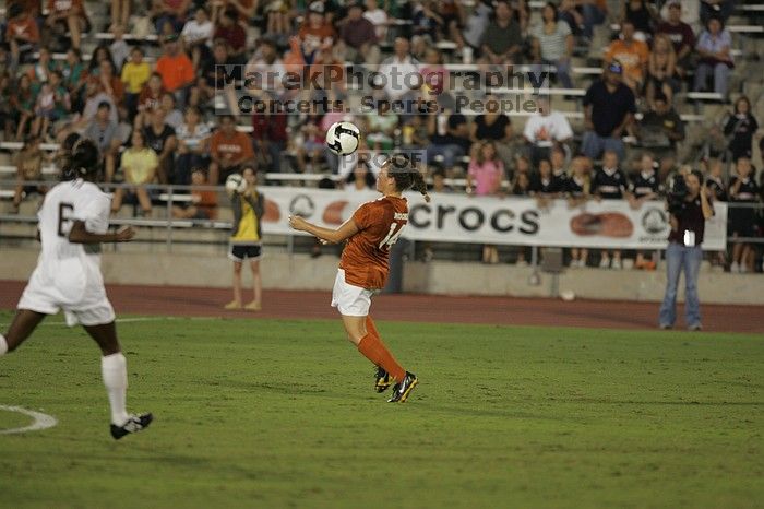 UT senior Kasey Moore (#14, Defender).  The University of Texas women's soccer team tied 0-0 against the Texas A&M Aggies Friday night, September 27, 2008.

Filename: SRM_20080926_2012280.jpg
Aperture: f/2.8
Shutter Speed: 1/500
Body: Canon EOS-1D Mark II
Lens: Canon EF 300mm f/2.8 L IS