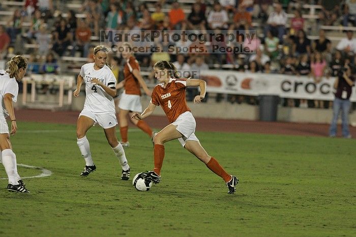 UT senior Jill Gilbeau (#4, Defender and Midfielder).  The University of Texas women's soccer team tied 0-0 against the Texas A&M Aggies Friday night, September 27, 2008.

Filename: SRM_20080926_2019562.jpg
Aperture: f/4.0
Shutter Speed: 1/400
Body: Canon EOS-1D Mark II
Lens: Canon EF 300mm f/2.8 L IS