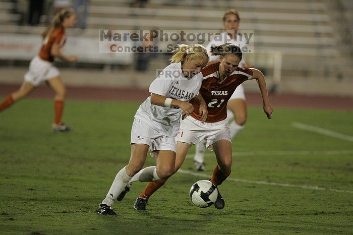 UT junior Emily Anderson (#21, Forward) plays defense on A&M #33.  The University of Texas women's soccer team tied 0-0 against the Texas A&M Aggies Friday night, September 27, 2008.

Filename: SRM_20080926_2027423.jpg
Aperture: f/2.8
Shutter Speed: 1/640
Body: Canon EOS-1D Mark II
Lens: Canon EF 300mm f/2.8 L IS