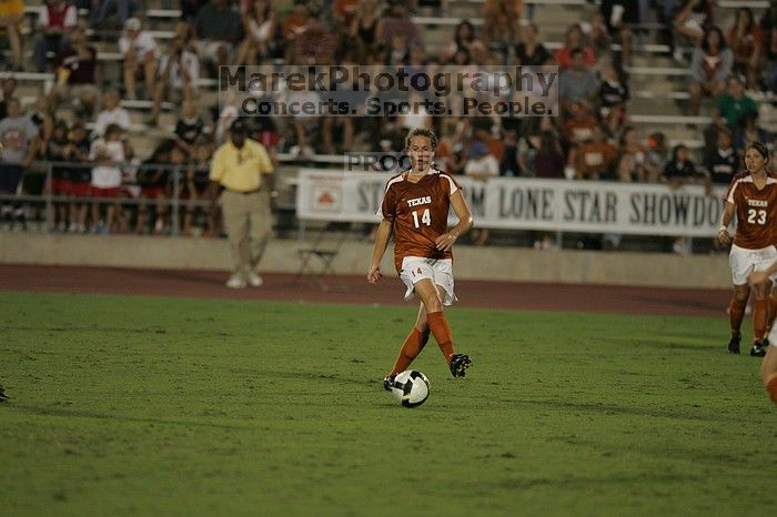 UT senior Kasey Moore (#14, Defender).  The University of Texas women's soccer team tied 0-0 against the Texas A&M Aggies Friday night, September 27, 2008.

Filename: SRM_20080926_2029480.jpg
Aperture: f/2.8
Shutter Speed: 1/640
Body: Canon EOS-1D Mark II
Lens: Canon EF 300mm f/2.8 L IS