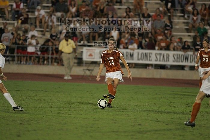 UT senior Kasey Moore (#14, Defender).  The University of Texas women's soccer team tied 0-0 against the Texas A&M Aggies Friday night, September 27, 2008.

Filename: SRM_20080926_2029489.jpg
Aperture: f/2.8
Shutter Speed: 1/640
Body: Canon EOS-1D Mark II
Lens: Canon EF 300mm f/2.8 L IS