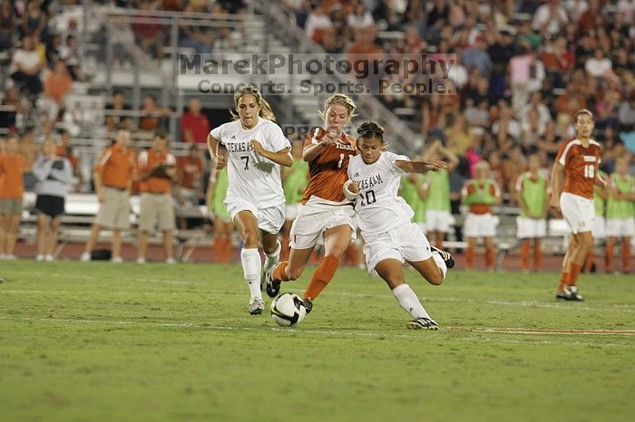 UT sophomore Niki Arlitt (#11, Forward) battles for the ball.  The University of Texas women's soccer team tied 0-0 against the Texas A&M Aggies Friday night, September 27, 2008.

Filename: SRM_20080926_2036567.jpg
Aperture: f/4.0
Shutter Speed: 1/200
Body: Canon EOS-1D Mark II
Lens: Canon EF 300mm f/2.8 L IS