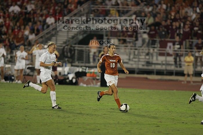 UT senior Stephanie Logterman (#10, Defender).  The University of Texas women's soccer team tied 0-0 against the Texas A&M Aggies Friday night, September 27, 2008.

Filename: SRM_20080926_2048264.jpg
Aperture: f/2.8
Shutter Speed: 1/500
Body: Canon EOS-1D Mark II
Lens: Canon EF 300mm f/2.8 L IS