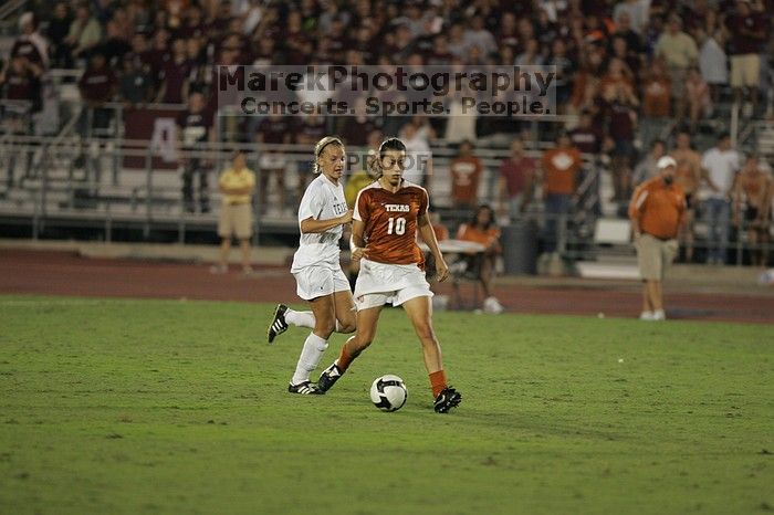 UT senior Stephanie Logterman (#10, Defender).  The University of Texas women's soccer team tied 0-0 against the Texas A&M Aggies Friday night, September 27, 2008.

Filename: SRM_20080926_2048286.jpg
Aperture: f/2.8
Shutter Speed: 1/500
Body: Canon EOS-1D Mark II
Lens: Canon EF 300mm f/2.8 L IS