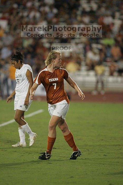 UT freshman Courtney Goodson (#7, Forward and Midfielder) takes the ball down the field.  The University of Texas women's soccer team tied 0-0 against the Texas A&M Aggies Friday night, September 27, 2008.

Filename: SRM_20080926_2048402.jpg
Aperture: f/2.8
Shutter Speed: 1/500
Body: Canon EOS-1D Mark II
Lens: Canon EF 300mm f/2.8 L IS