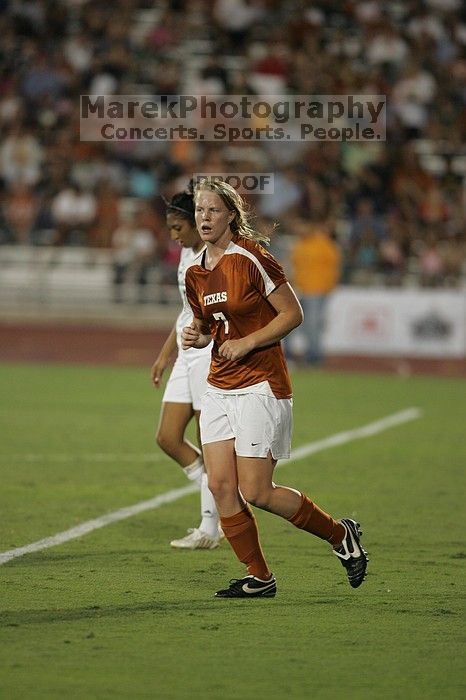 UT freshman Courtney Goodson (#7, Forward and Midfielder) takes the ball down the field.  The University of Texas women's soccer team tied 0-0 against the Texas A&M Aggies Friday night, September 27, 2008.

Filename: SRM_20080926_2048404.jpg
Aperture: f/2.8
Shutter Speed: 1/500
Body: Canon EOS-1D Mark II
Lens: Canon EF 300mm f/2.8 L IS