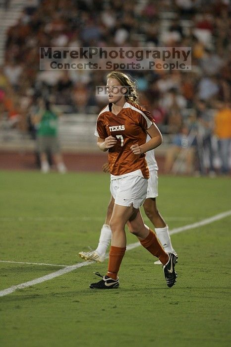 UT freshman Courtney Goodson (#7, Forward and Midfielder) takes the ball down the field.  The University of Texas women's soccer team tied 0-0 against the Texas A&M Aggies Friday night, September 27, 2008.

Filename: SRM_20080926_2048405.jpg
Aperture: f/2.8
Shutter Speed: 1/500
Body: Canon EOS-1D Mark II
Lens: Canon EF 300mm f/2.8 L IS