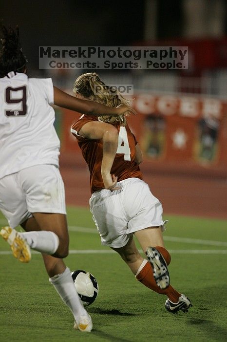 UT senior Jill Gilbeau (#4, Defender and Midfielder).  The University of Texas women's soccer team tied 0-0 against the Texas A&M Aggies Friday night, September 27, 2008.

Filename: SRM_20080926_2049124.jpg
Aperture: f/2.8
Shutter Speed: 1/500
Body: Canon EOS-1D Mark II
Lens: Canon EF 300mm f/2.8 L IS