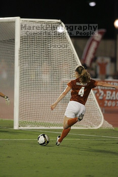 UT senior Jill Gilbeau (#4, Defender and Midfielder) takes a shot on goal.  The University of Texas women's soccer team tied 0-0 against the Texas A&M Aggies Friday night, September 27, 2008.

Filename: SRM_20080926_2049161.jpg
Aperture: f/2.8
Shutter Speed: 1/500
Body: Canon EOS-1D Mark II
Lens: Canon EF 300mm f/2.8 L IS